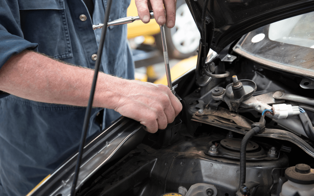 Car Mechanic Checking for Repair