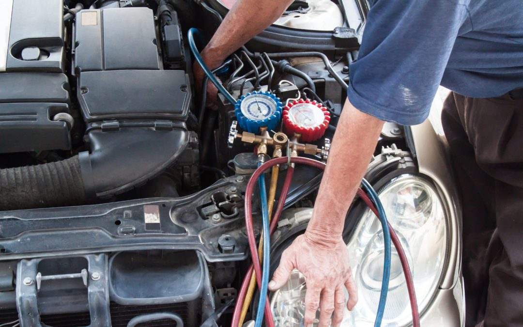 Mechanic Doing Car Air Filter Maintenance